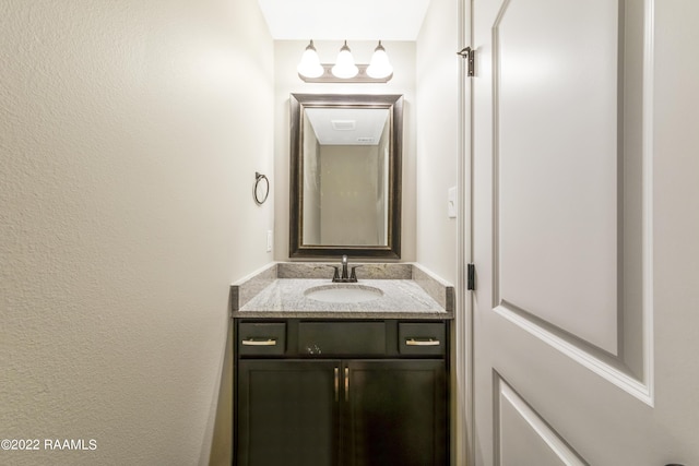 119 Sandstone Ave, Scott, LA 70583 - bathroom featuring vanity and a textured wall