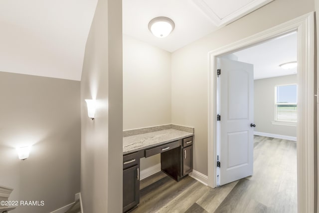 119 Sandstone Ave, Scott, LA 70583 - hallway featuring light wood finished floors, baseboards, and a desk