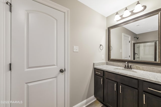 119 Sandstone Ave, Scott, LA 70583 - bathroom featuring vanity, baseboards, and a shower