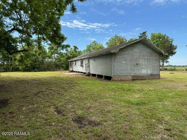18711 La Highway 35, Abbeville, LA 70510 - view of side of property featuring a yard