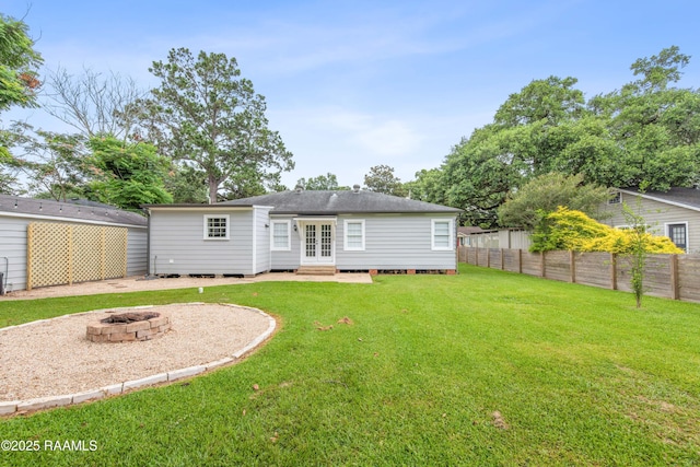 110 Memory Ln, Lafayette, LA 70506 - back of property featuring french doors, a fire pit, entry steps, and a shingled roof
