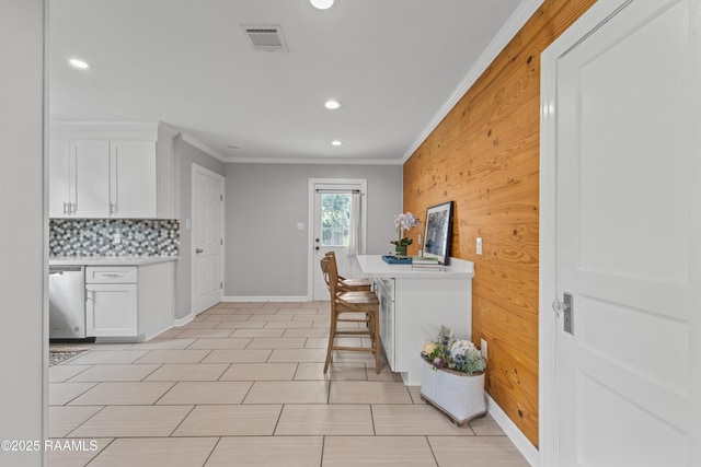 110 Memory Ln, Lafayette, LA 70506 - kitchen with stainless steel dishwasher, crown molding, recessed lighting, backsplash, and white cabinets