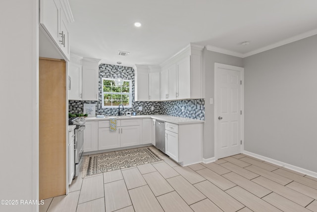 110 Memory Ln, Lafayette, LA 70506 - kitchen featuring stainless steel appliances, a sink, decorative backsplash, light countertops, and recessed lighting