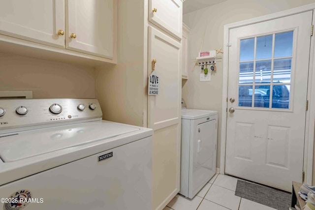 114 Cane Ridge Cir, Lafayette, LA 70508 - laundry room with washing machine and clothes dryer, cabinet space, and light tile patterned floors