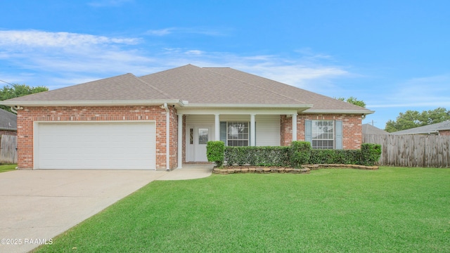 2116 George Dr, Opelousas, LA 70570 - view of front of house featuring driveway, an attached garage, brick siding, and roof with shingles