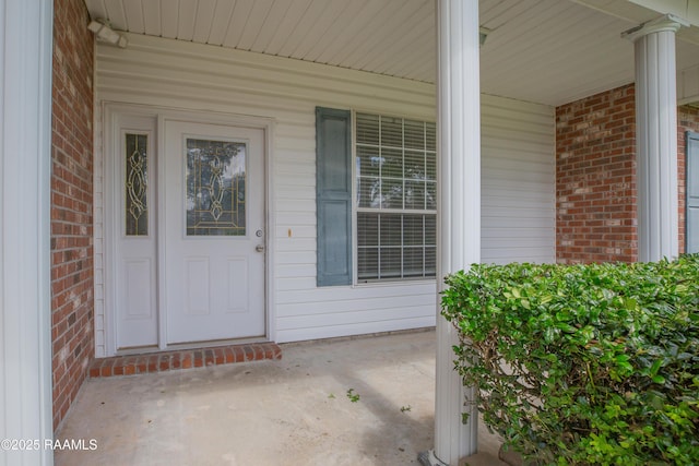 2116 George Dr, Opelousas, LA 70570 - view of exterior entry with brick siding and a porch