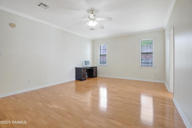 2116 George Dr, Opelousas, LA 70570 - spare room featuring light wood finished floors, a ceiling fan, ornamental molding, baseboards, and a smoke detector