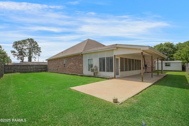 2116 George Dr, Opelousas, LA 70570 - rear view of house with a patio, brick siding, and a sunroom