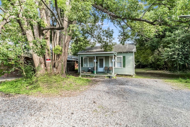 1110 Louisiana Ave, Lafayette, LA 70501 - bungalow-style house featuring a porch, driveway, and a shingled roof