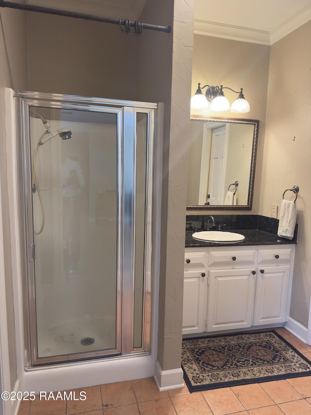 404 Old Settlement Rd, Lafayette, LA 70508 - full bathroom with crown molding, a stall shower, vanity, tile patterned flooring, and baseboards