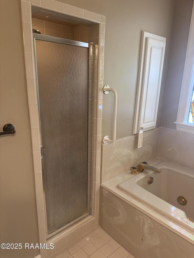 404 Old Settlement Rd, Lafayette, LA 70508 - bathroom with a shower stall, a garden tub, and tile patterned floors