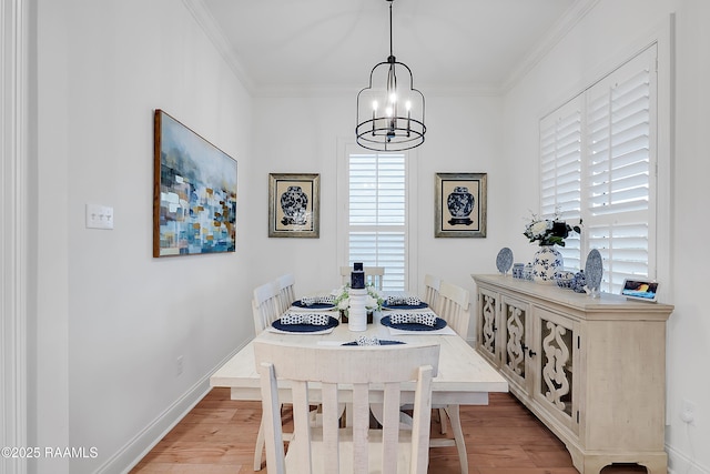 337 Bozeman Trl, Scott, LA 70583 - dining room featuring a chandelier, light wood-type flooring, and crown molding