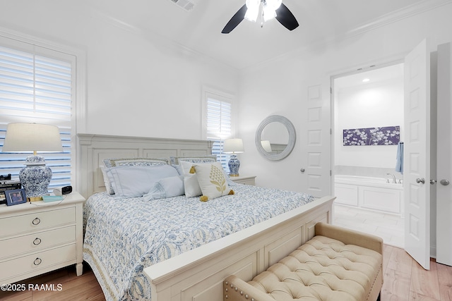 337 Bozeman Trl, Scott, LA 70583 - bedroom with ornamental molding, wood finished floors, connected bathroom, and a ceiling fan