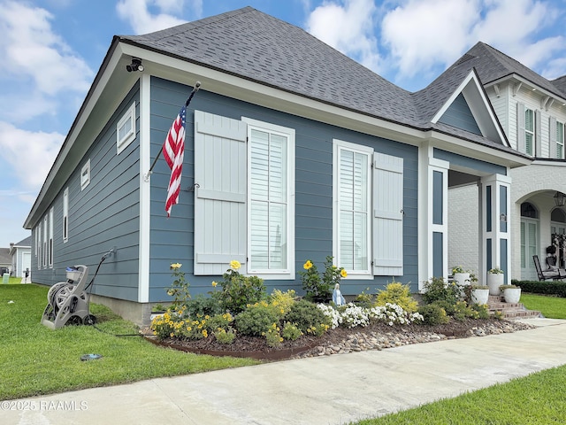 337 Bozeman Trl, Scott, LA 70583 - view of property exterior with a shingled roof and a lawn
