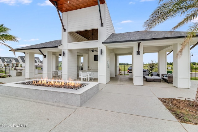 337 Bozeman Trl, Scott, LA 70583 - view of patio featuring an outdoor living space with a fire pit, ceiling fan, an outdoor kitchen, and a bar