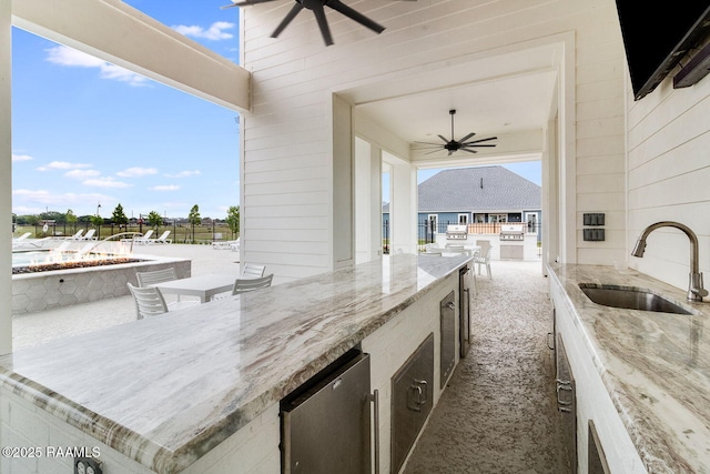 337 Bozeman Trl, Scott, LA 70583 - view of patio featuring a ceiling fan, area for grilling, and an outdoor fire pit