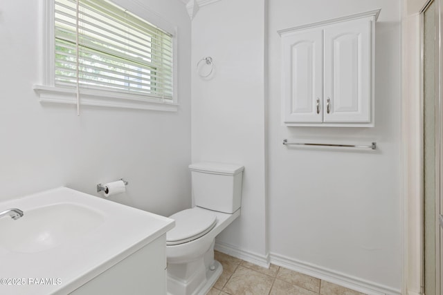 4119 Pleasant Dr, Lake Charles, LA 70605 - bathroom featuring toilet, vanity, baseboards, tile patterned floors, and an enclosed shower