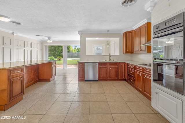 4119 Pleasant Dr, Lake Charles, LA 70605 - kitchen featuring appliances with stainless steel finishes, a sink, backsplash, a ceiling fan, and brown cabinets