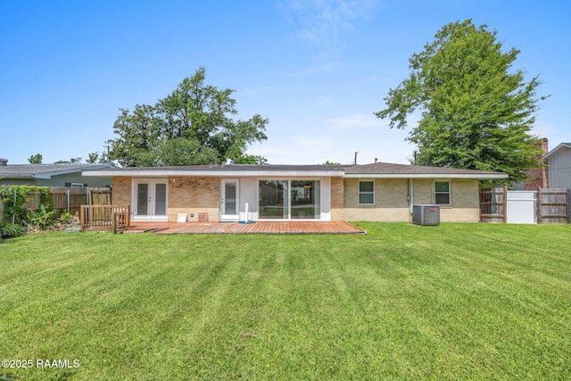 4119 Pleasant Dr, Lake Charles, LA 70605 - rear view of house featuring cooling unit, brick siding, a deck, and french doors