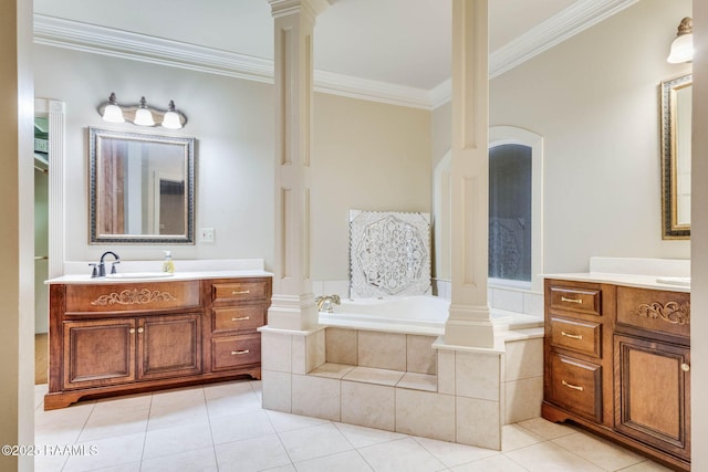 605 Terrell Ct, New Iberia, LA 70563 - bathroom featuring decorative columns, ornamental molding, two vanities, a garden tub, and tile patterned floors