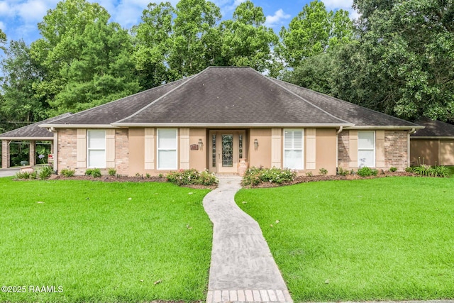 2424 Vista Dr, Opelousas, LA 70570 - ranch-style house featuring a shingled roof, stucco siding, a front lawn, and a carport