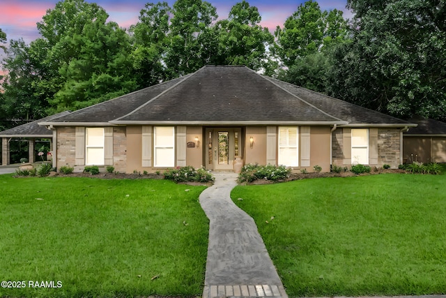 2424 Vista Dr, Opelousas, LA 70570 - ranch-style home featuring a front lawn, roof with shingles, and stucco siding