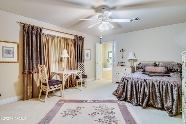 2424 Vista Dr, Opelousas, LA 70570 - bedroom featuring carpet flooring, baseboards, a ceiling fan, and ensuite bathroom