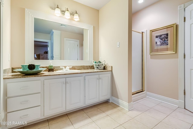 2424 Vista Dr, Opelousas, LA 70570 - full bath featuring double vanity, tile patterned flooring, and a stall shower