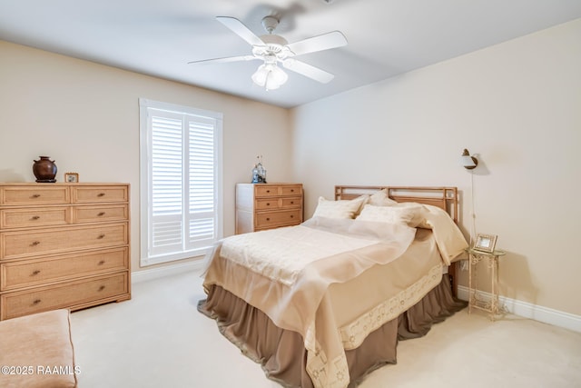 2424 Vista Dr, Opelousas, LA 70570 - bedroom with light colored carpet, a ceiling fan, and baseboards