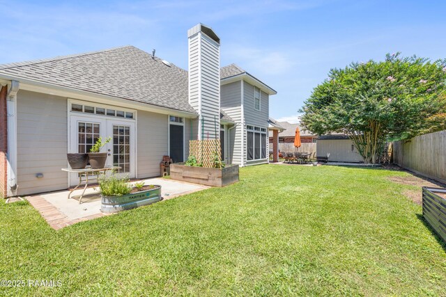 202 Kincaid Ct, Lafayette, LA 70508 - rear view of house featuring a patio, a chimney, roof with shingles, and french doors