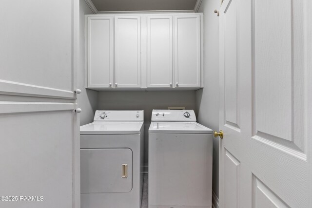 202 Kincaid Ct, Lafayette, LA 70508 - laundry area featuring separate washer and dryer and cabinet space