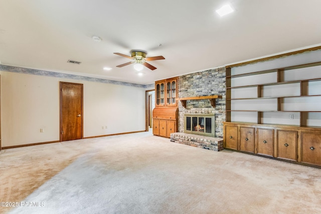 138 Cypress Dr, Opelousas, LA 70570 - unfurnished living room with ceiling fan, baseboards, light carpet, and a fireplace