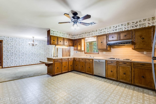 138 Cypress Dr, Opelousas, LA 70570 - kitchen with dishwasher, wallpapered walls, under cabinet range hood, a sink, and light countertops