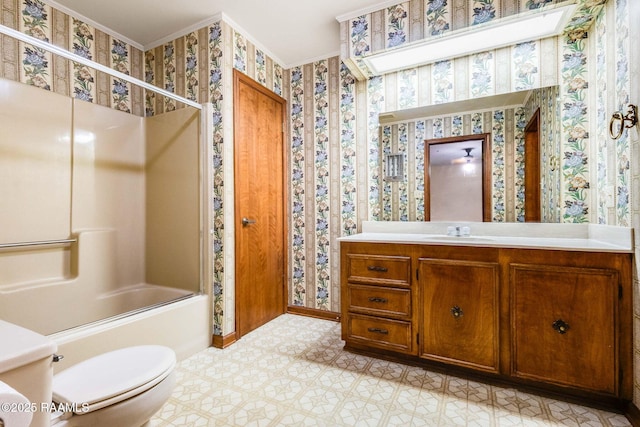138 Cypress Dr, Opelousas, LA 70570 - full bath with toilet, vanity, wallpapered walls, enclosed tub / shower combo, and baseboards