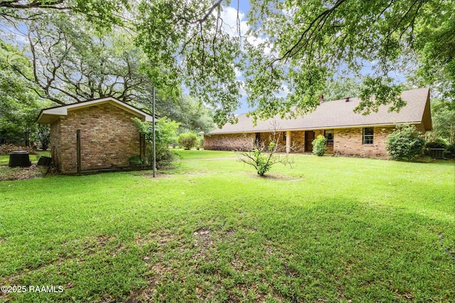 138 Cypress Dr, Opelousas, LA 70570 - view of grassy yard featuring central AC unit
