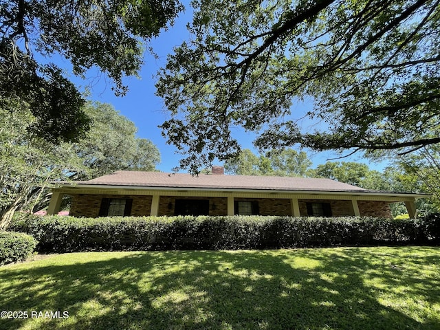 138 Cypress Dr, Opelousas, LA 70570 - ranch-style home featuring a front yard, brick siding, and a chimney