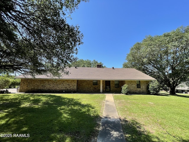 138 Cypress Dr, Opelousas, LA 70570 - ranch-style home featuring brick siding, a front lawn, and a chimney