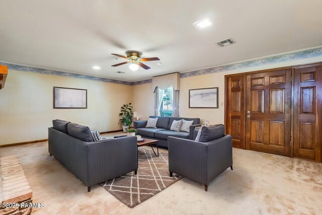 138 Cypress Dr, Opelousas, LA 70570 - living area featuring light carpet, ceiling fan, and baseboards