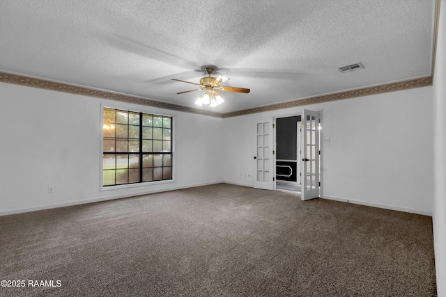 504 Presbytere Pkwy, Lafayette, LA 70503 - spare room with carpet floors, a ceiling fan, a textured ceiling, baseboards, and french doors