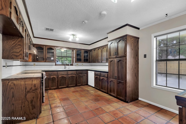 504 Presbytere Pkwy, Lafayette, LA 70503 - kitchen with crown molding, dishwasher, healthy amount of natural light, glass insert cabinets, and a sink
