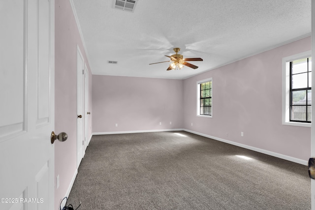 504 Presbytere Pkwy, Lafayette, LA 70503 - carpeted empty room featuring a ceiling fan, baseboards, a textured ceiling, and ornamental molding