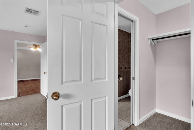 504 Presbytere Pkwy, Lafayette, LA 70503 - corridor featuring carpet flooring, baseboards, and tile patterned flooring