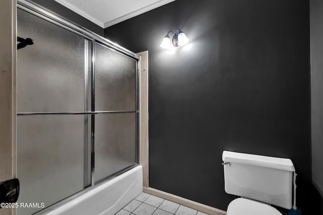 504 Presbytere Pkwy, Lafayette, LA 70503 - bathroom with crown molding, toilet, tile patterned flooring, shower / bath combination with glass door, and baseboards