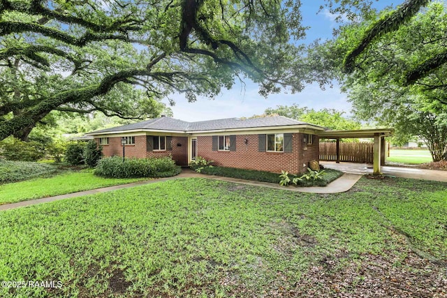 102 White Cir, Lafayette, LA 70506 - single story home featuring brick siding and an attached carport