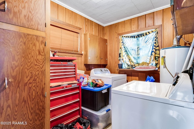 102 White Cir, Lafayette, LA 70506 - laundry area with washer and clothes dryer, water heater, wooden walls, ornamental molding, and cabinet space