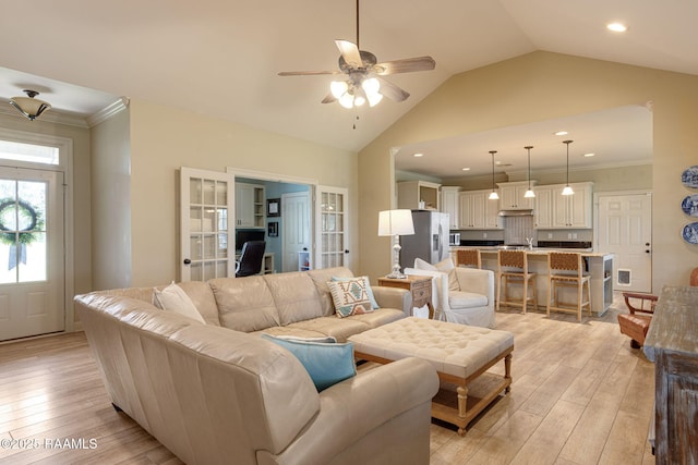 209 E Vincent St, Maurice, LA 70555 - living area featuring light wood-type flooring, ceiling fan, lofted ceiling, ornamental molding, and french doors