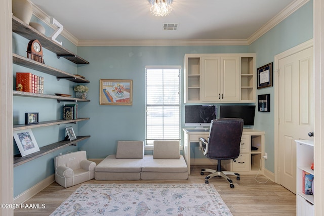 209 E Vincent St, Maurice, LA 70555 - office space featuring light wood-style floors, crown molding, built in desk, and baseboards
