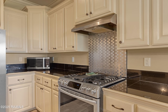 209 E Vincent St, Maurice, LA 70555 - kitchen with appliances with stainless steel finishes, range hood, and backsplash