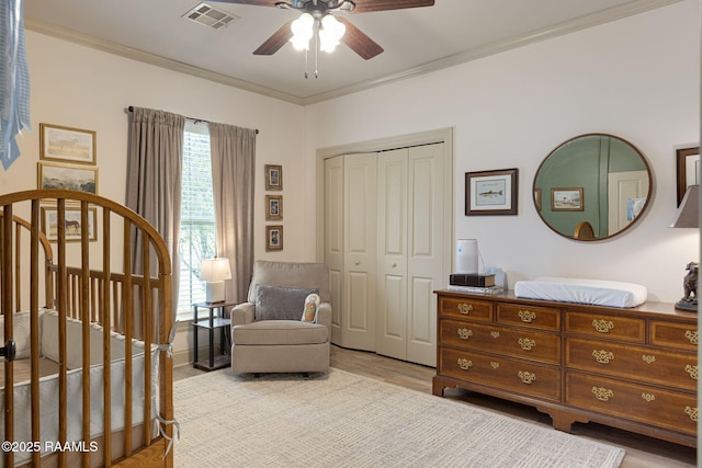 209 E Vincent St, Maurice, LA 70555 - bedroom featuring a closet, wood finished floors, ornamental molding, and a ceiling fan