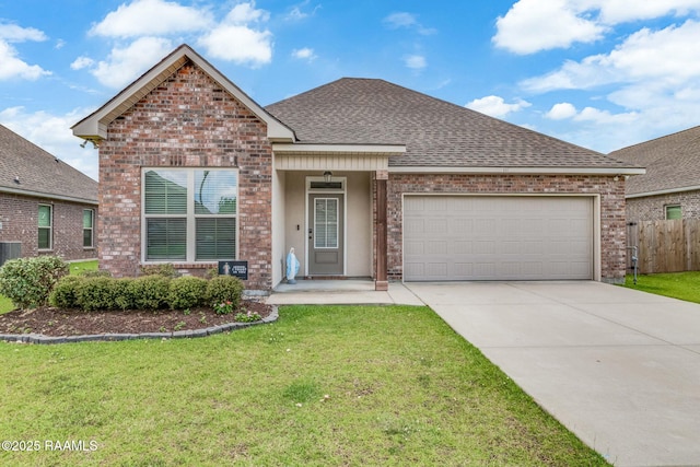 111 Rose Of Sharon Ln, Lafayette, LA 70508 - view of front of house featuring concrete driveway, a garage, brick siding, and roof with shingles